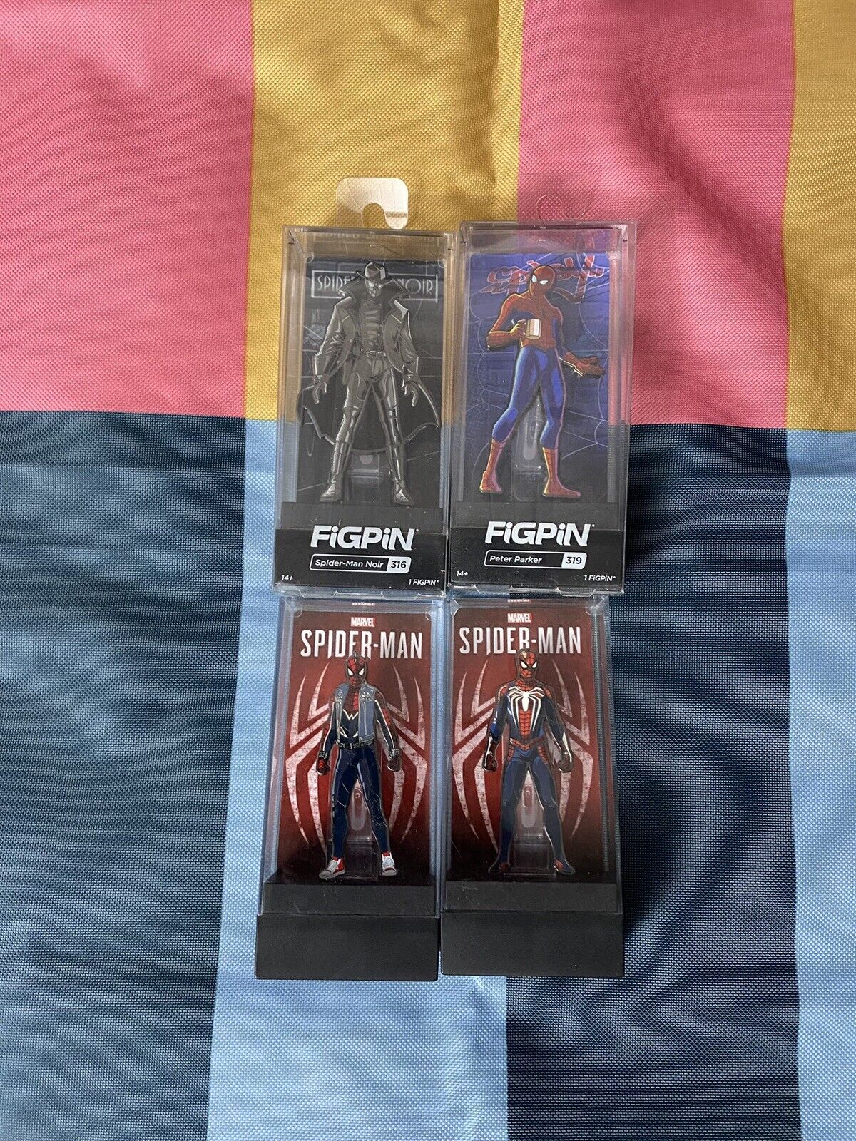 FiGPiN Lot Of 4 Spider-Man Noir, Punk Spider, Spider-Man, And Peter Parker