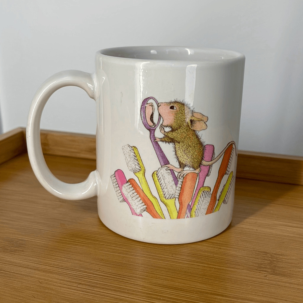 Vintage House Mouse stoneware coffee mug checking his teeth