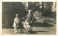 RPPC Grandmother with Grandchildren Baby Carriage Scroller in yard B&W Postcard  picture