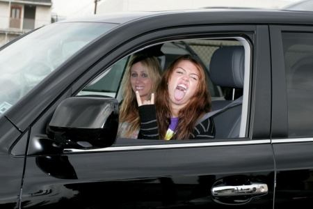 Miley Cyrus shows off  driver's permit.