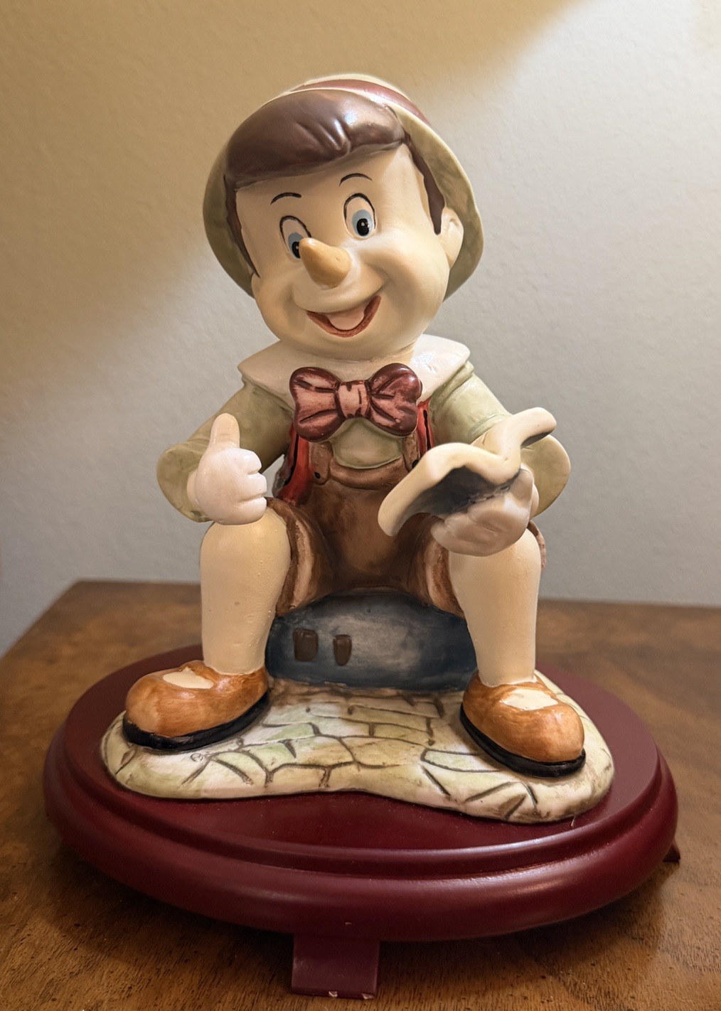 5th Avenue Collection Disney Porcelain Pinocchio Figurine on cherry wood base 5th Avenue Collection Disney Porcelain Pinocchio Figurine on cherry wood base