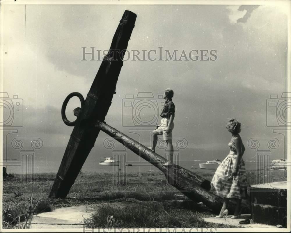 1957 Press Photo Visitors check an old anchor at Kingston Harbor in Jamaica