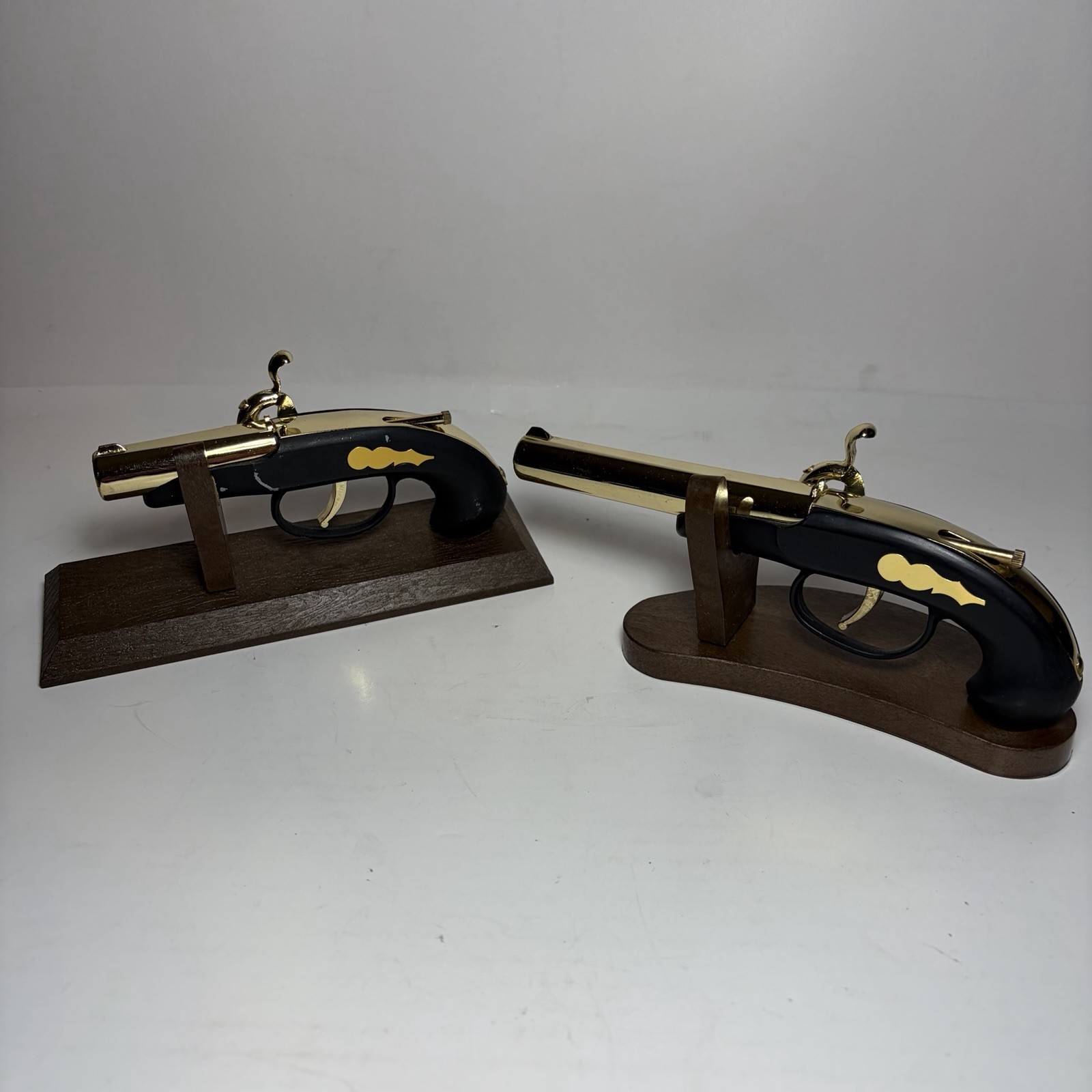 2 Vintage Flintlock Pistol-Shaped Lighters Made in Japan with Wooden Stands 2 Vintage Flintlock Pistol-Shaped Lighters Made in Japan with Wooden Stands