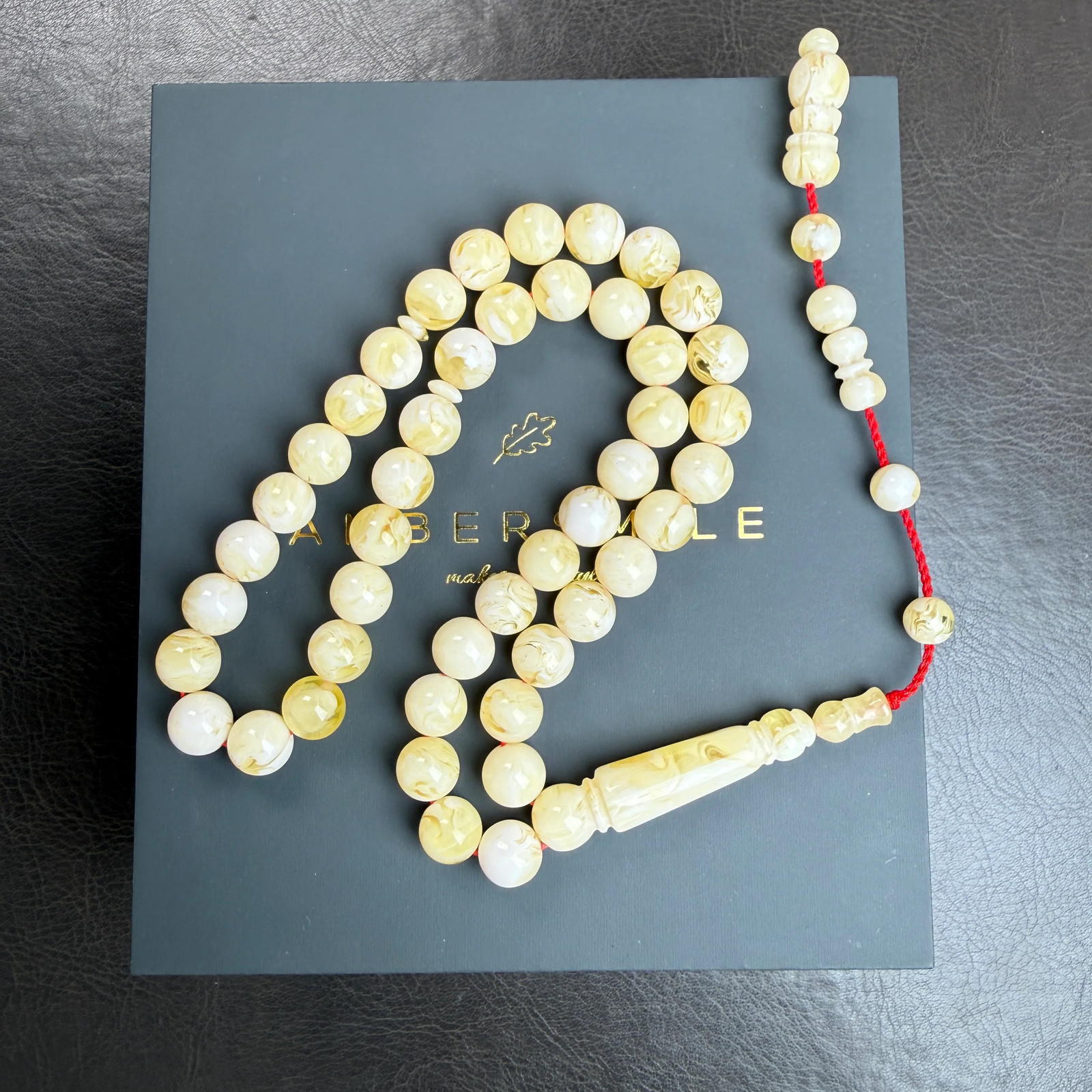 White Pressed Amber Style Misbaha Tasbih with Tamlika 37g | 10mm | 45 beads White Pressed Amber Style Misbaha Tasbih with Tamlika 37g | 10mm | 45 beads