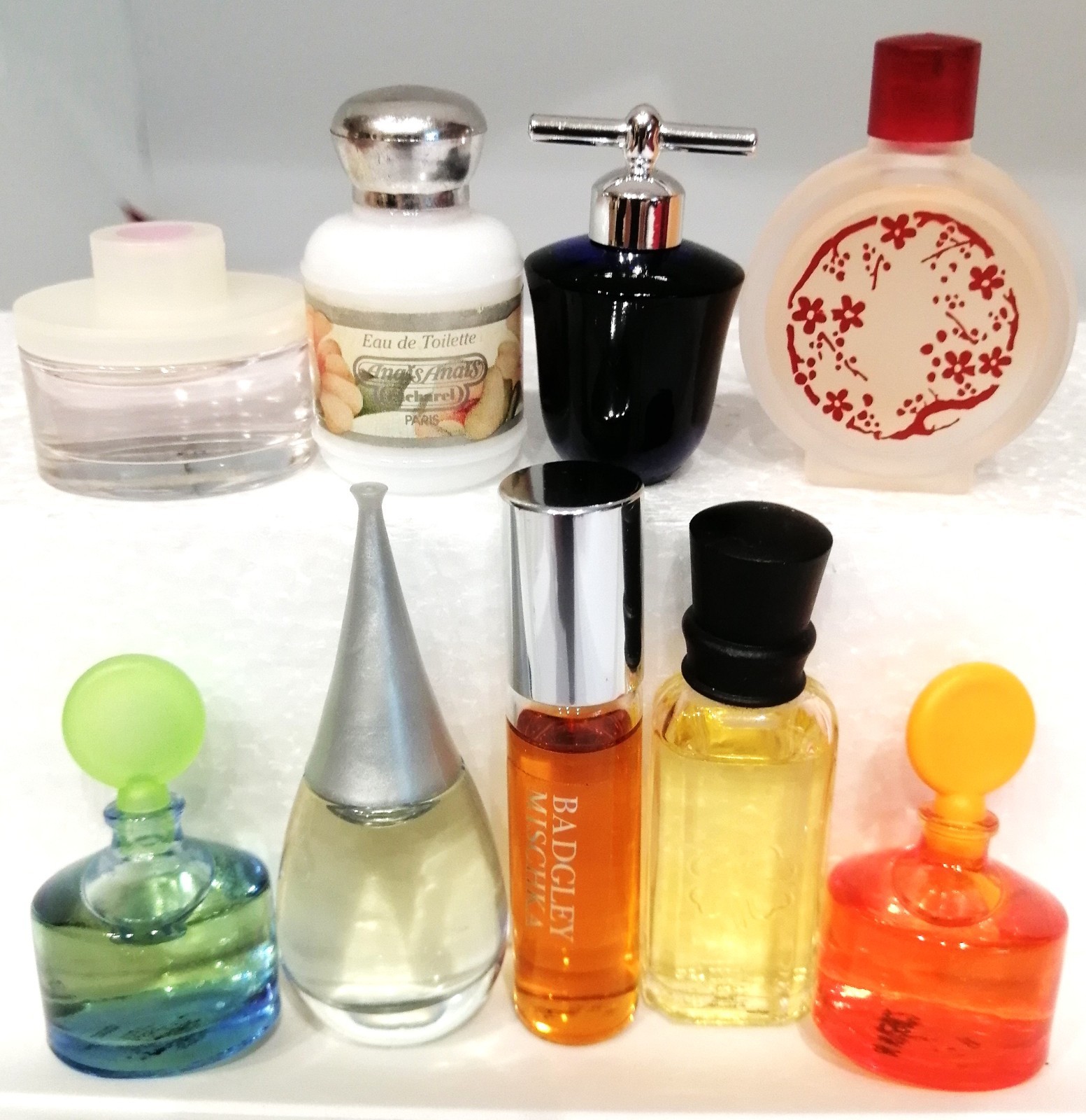 Lot of 9 Mini Bottles Collectible Fragrances by Different Designers. Lot of 9 Mini Bottles Collectible Fragrances by Different Designers.