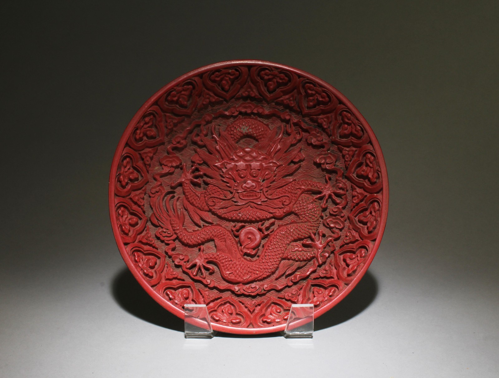 A Cinnabar Plate, "QianLong" mark at base A Cinnabar Plate, "QianLong" mark at base