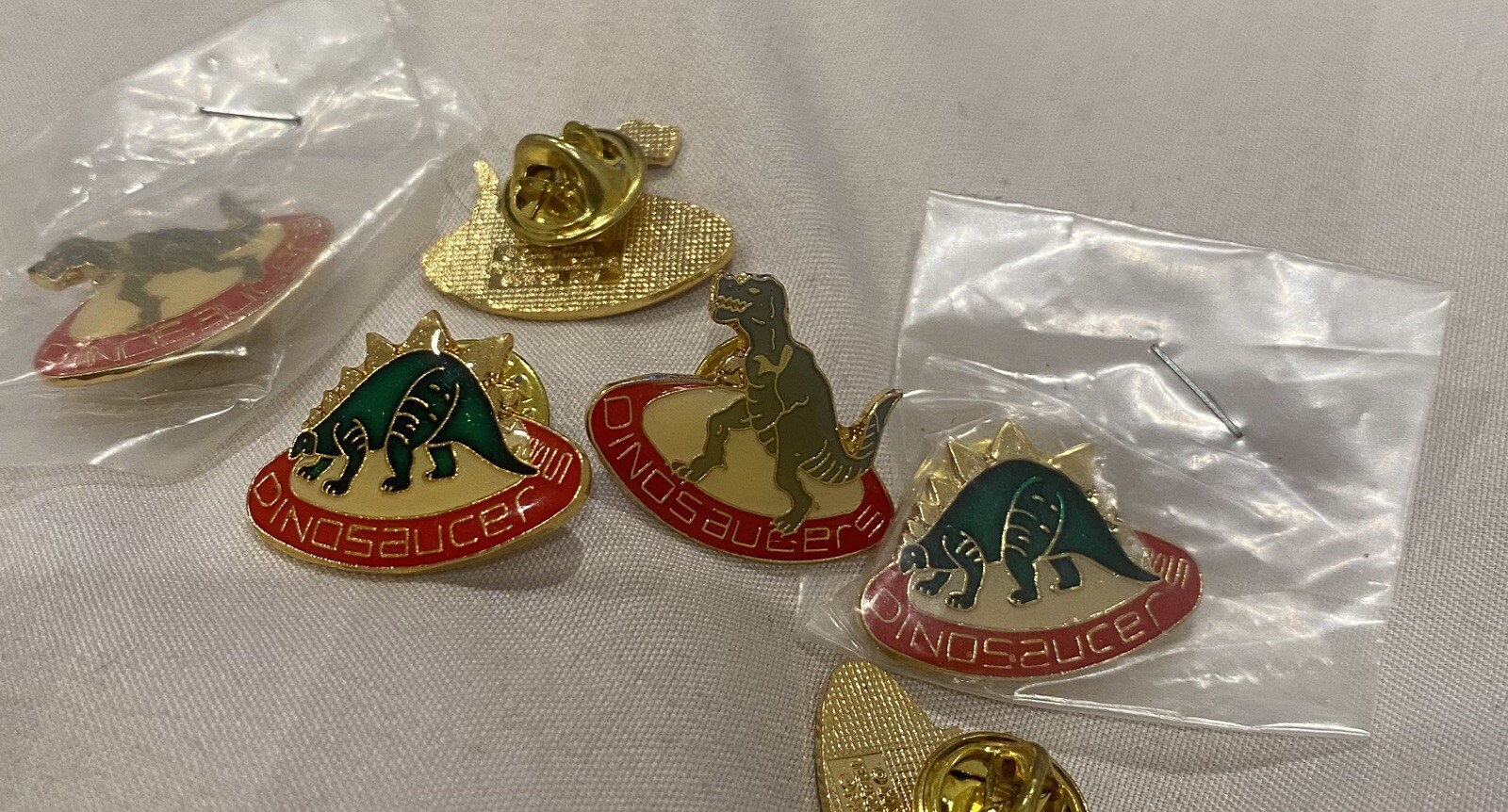 Vintage 1987 Dinosaucer Lapel Pin. Coca Cola Telecommunications 1987 Printed on Vintage 1987 Dinosaucer Lapel Pin. Coca Cola Telecommunications 1987 Printed on