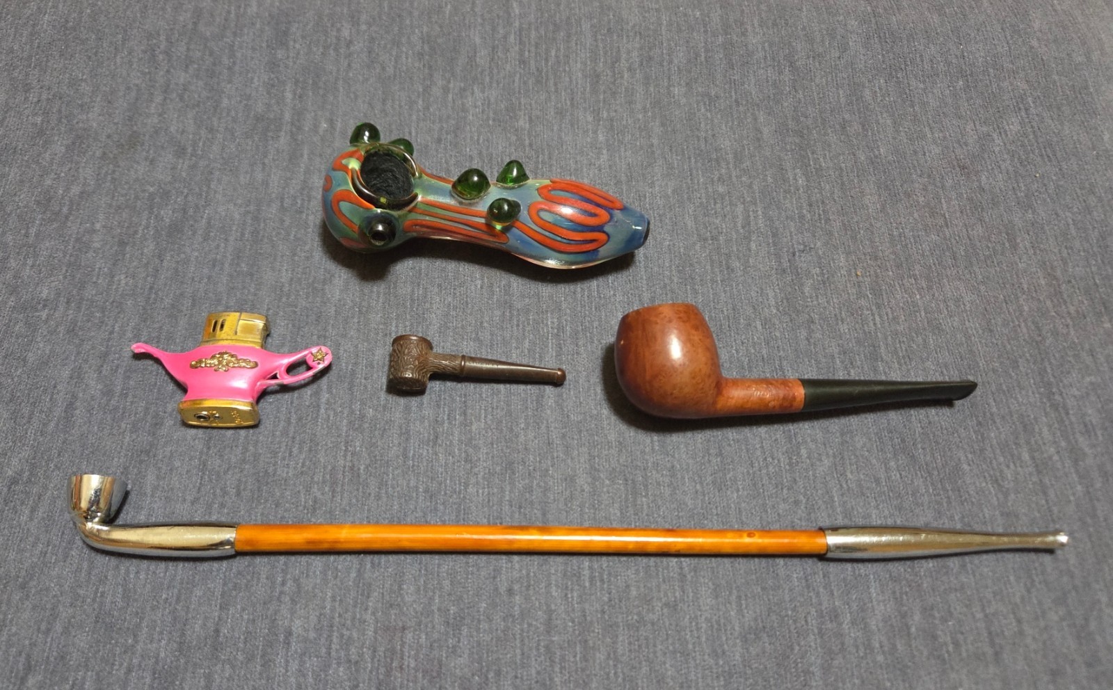 Four Used Smoking Pipes & Pink Pocket Lighter