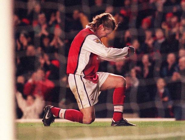 Emmanuel Petit celebrates in the goalmouth after scoring Arsenal's- Old Photo