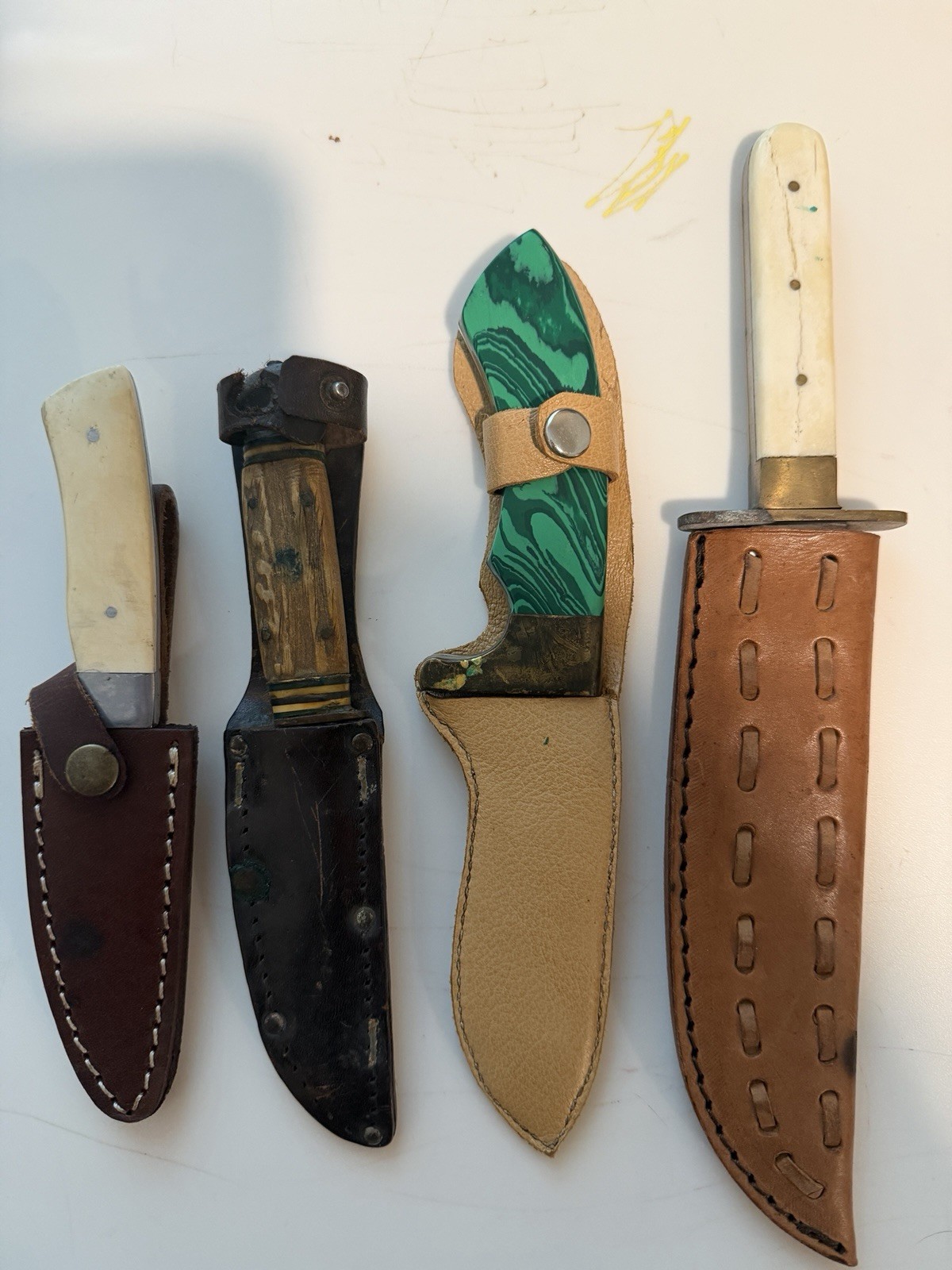 Lot of 4 Vintage Fixed Blade Hunting Knives - all with holsters as pictured