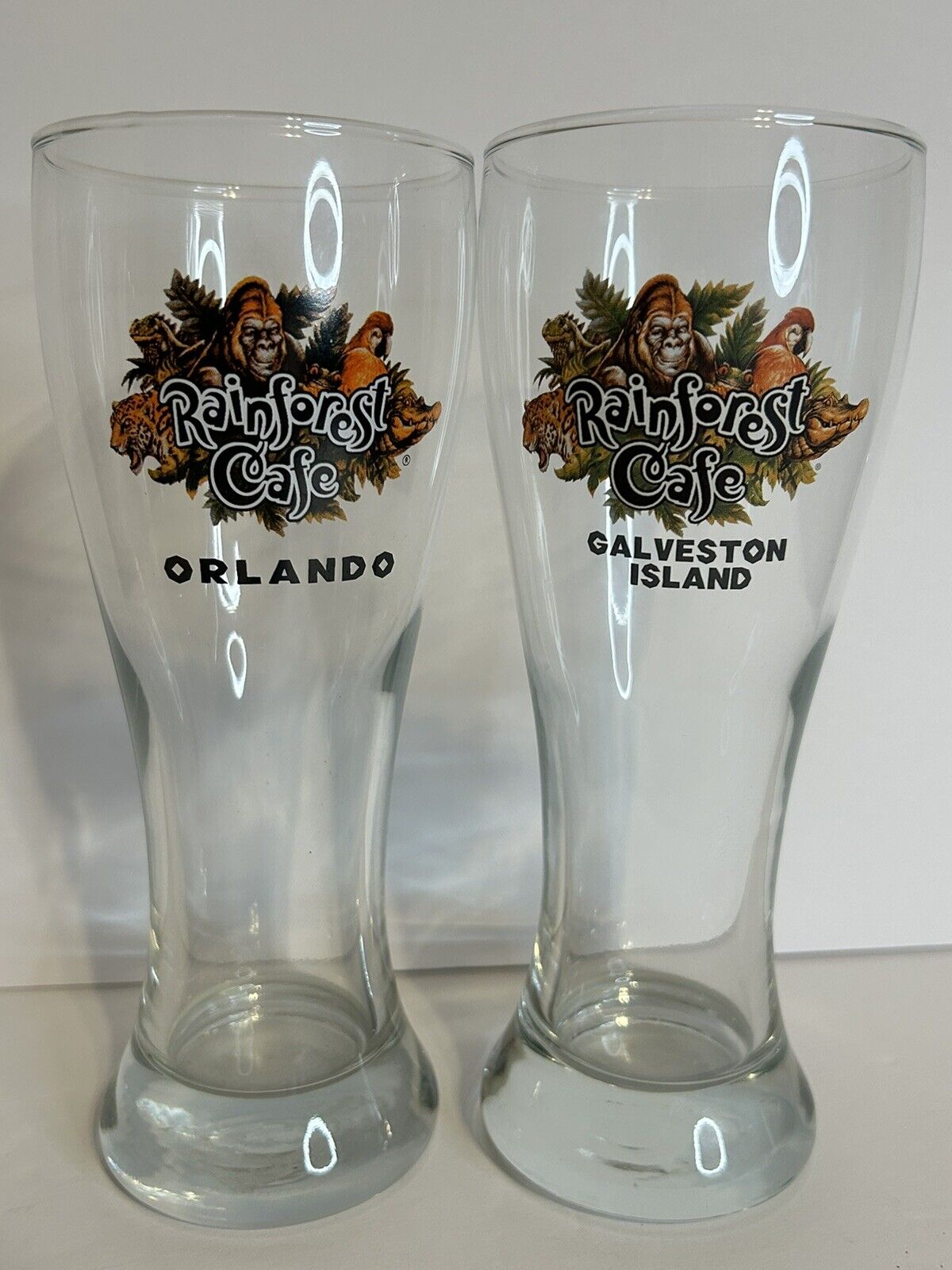 (2) Rainforest Cafe Tall Beer Glasses - Orlando and Galveston Island