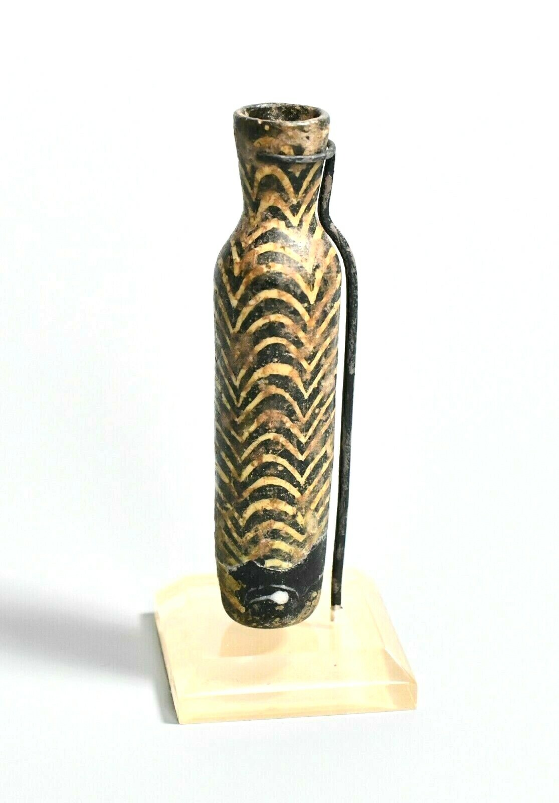 RARE ITEMS An Islamic Core Formed Glass Vial