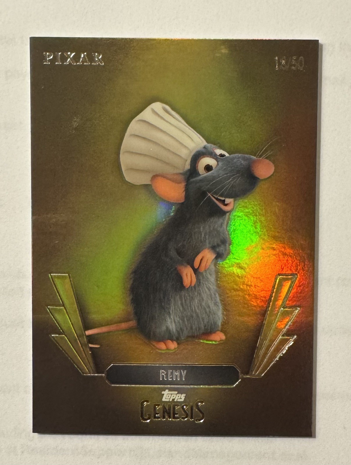 2025 Topps Disney Pixar Genesis Remy Gold  /50