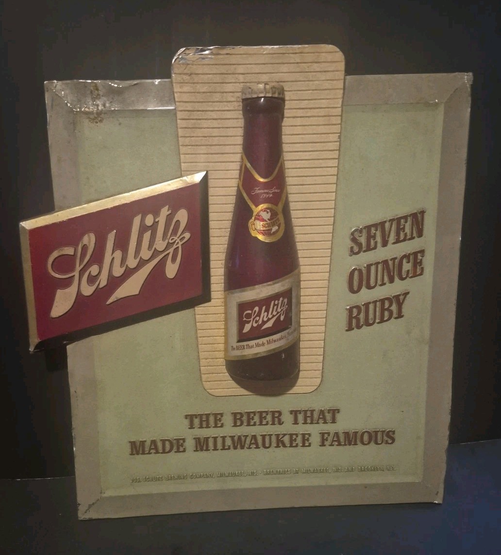 1943 Schlitz Beer Bottle Composition Sign 7 OZ Ruby Red Bottle on It. 1943 Schlitz Beer Bottle Composition Sign 7 OZ Ruby Red Bottle on It.
