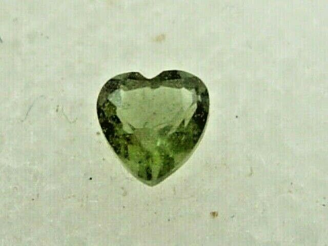 .116 carat Moldavite Faceted Heart Czech Republic Meteorite impact about 3x3x2mm .116 carat Moldavite Faceted Heart Czech Republic Meteorite impact about 3x3x2mm