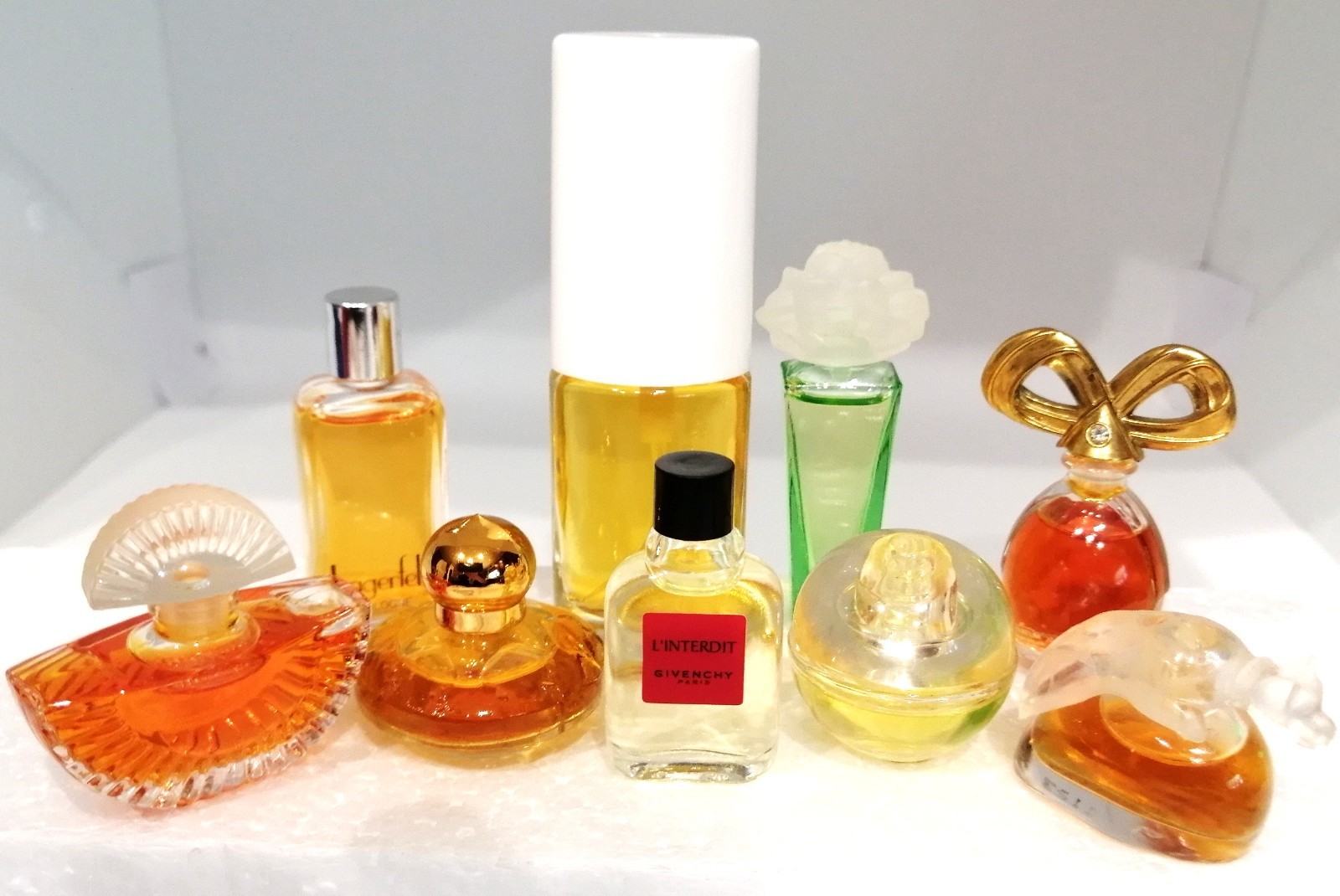 Lot of 9 Mini Bottles Collectible Fragrances by Different Designers. Lot of 9 Mini Bottles Collectible Fragrances by Different Designers.