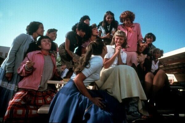 Grease Olivia Newton-John sits on table with girls 5x7 inch photo