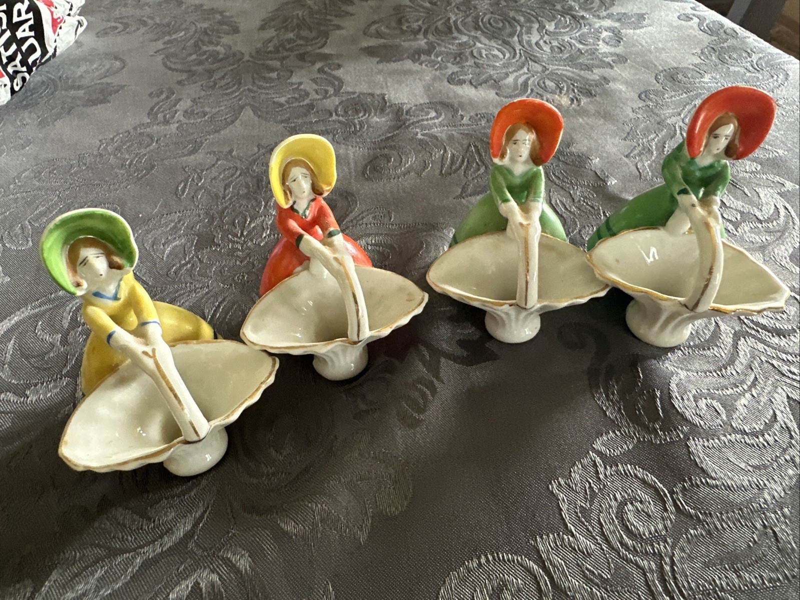 4 Vtg Japan Porcelain Girl W Hat Holds Basket Figurines ~ Orange/Green/Yellow