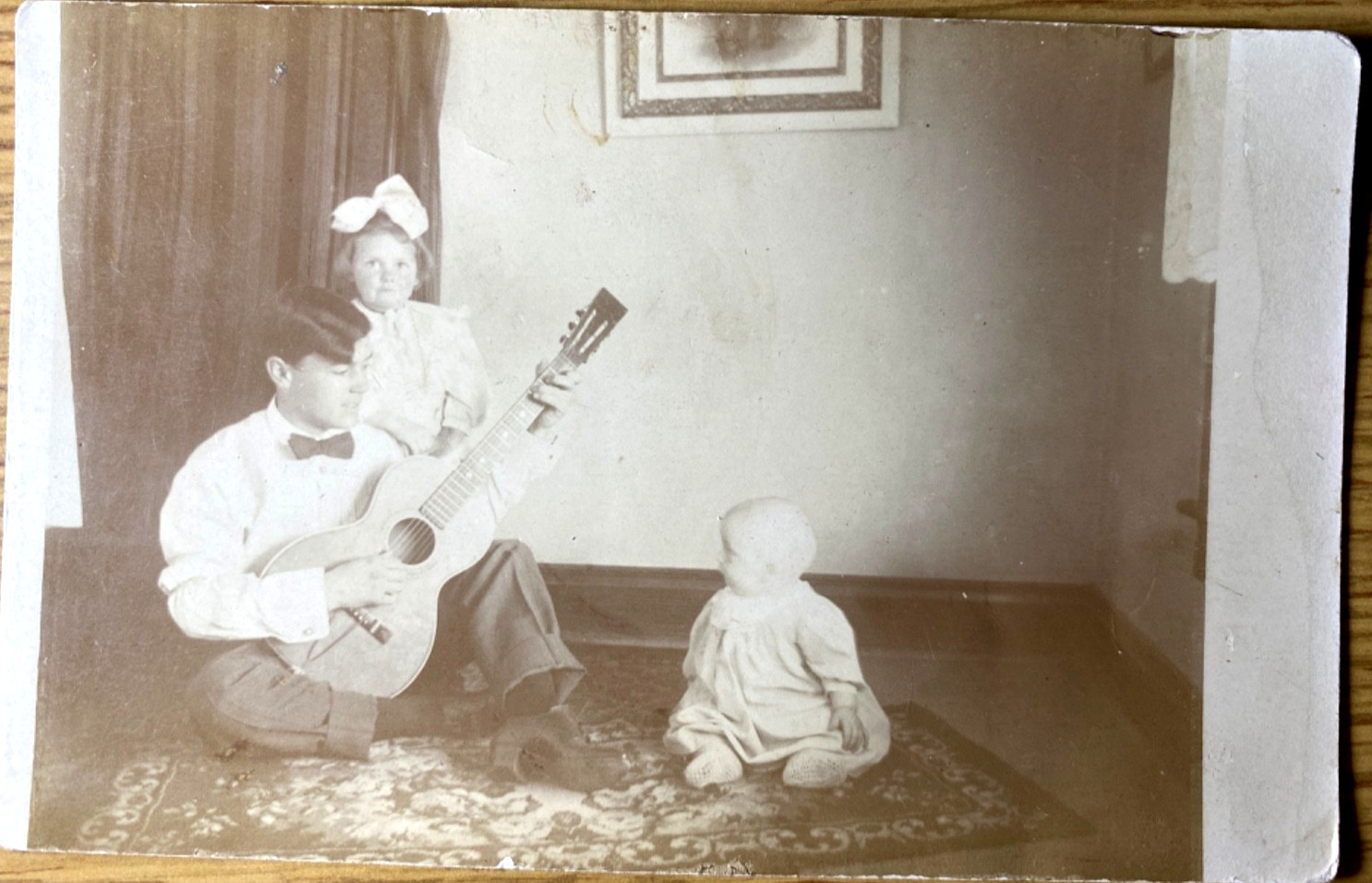 1910s RPPC - YOUNG GUITARIST PLAYING TO HIS SIBLINGS antique real photo postcard 1910s RPPC - YOUNG GUITARIST PLAYING TO HIS SIBLINGS antique real photo postcard