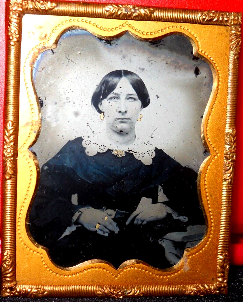 1/9th size Ambrotype of young lady in brass mat/frame