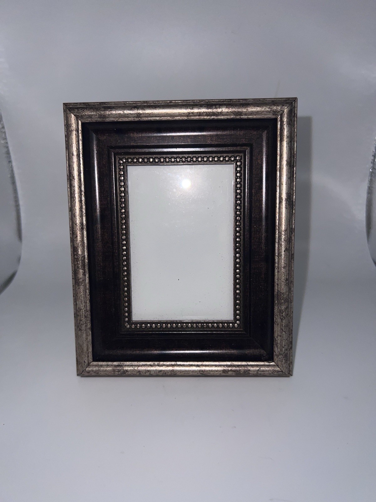 Traditional tabletop frame featuring an antique-inspired multi-layered design