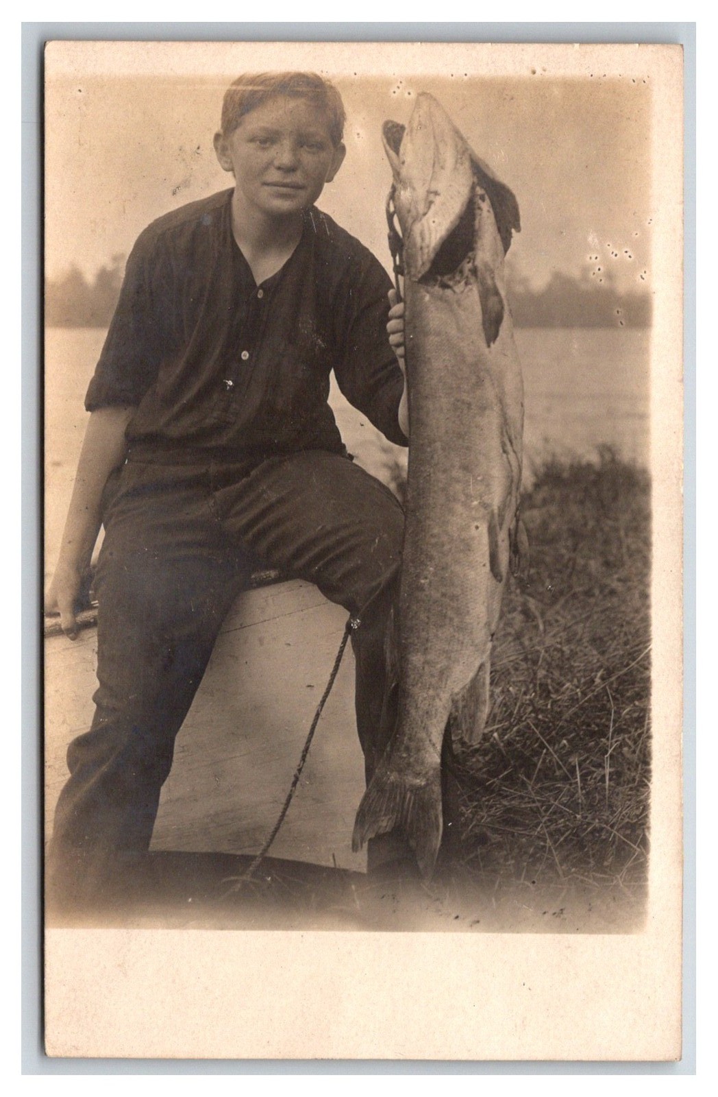 RPPC ~ Young boy Fisherman W giant Muskie ~ Fishing hunting RPPC ~ Young boy Fisherman W giant Muskie ~ Fishing hunting