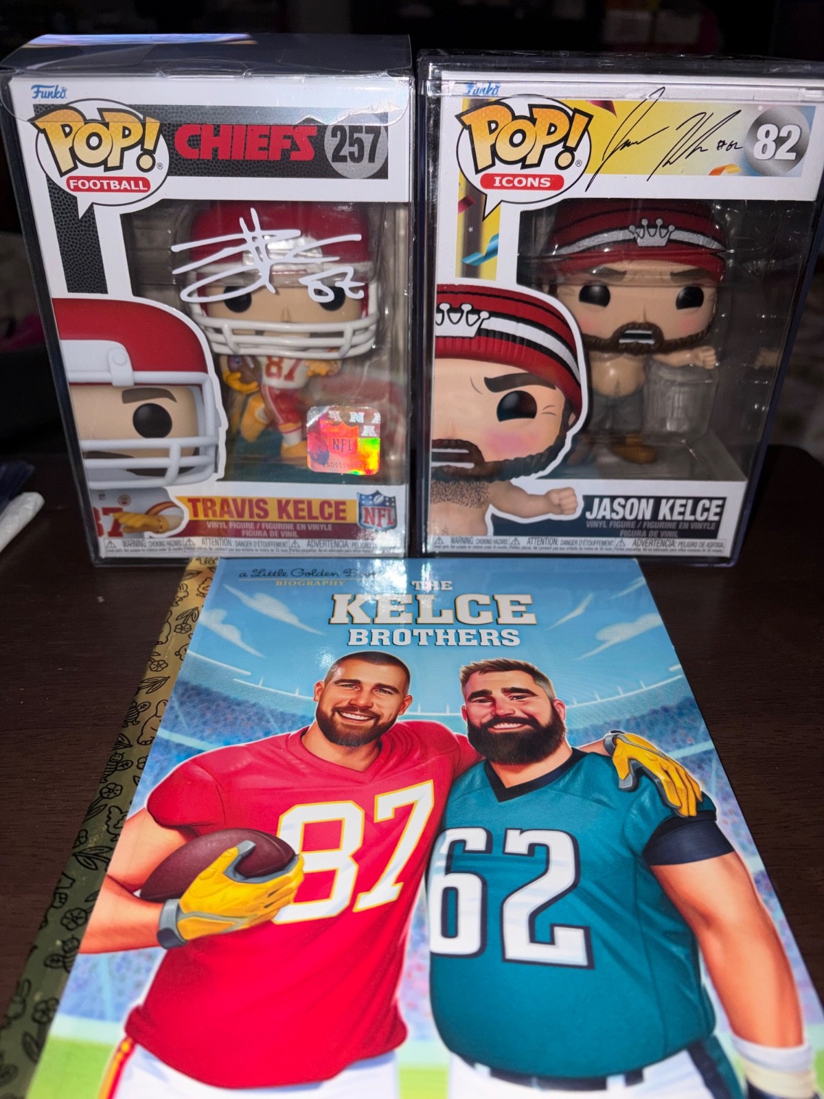 Funko Pop Travis Kelce #257 & Jason Kelce #82 (autographed) Kelce Brothers Book Funko Pop Travis Kelce #257 & Jason Kelce #82 (autographed) Kelce Brothers Book