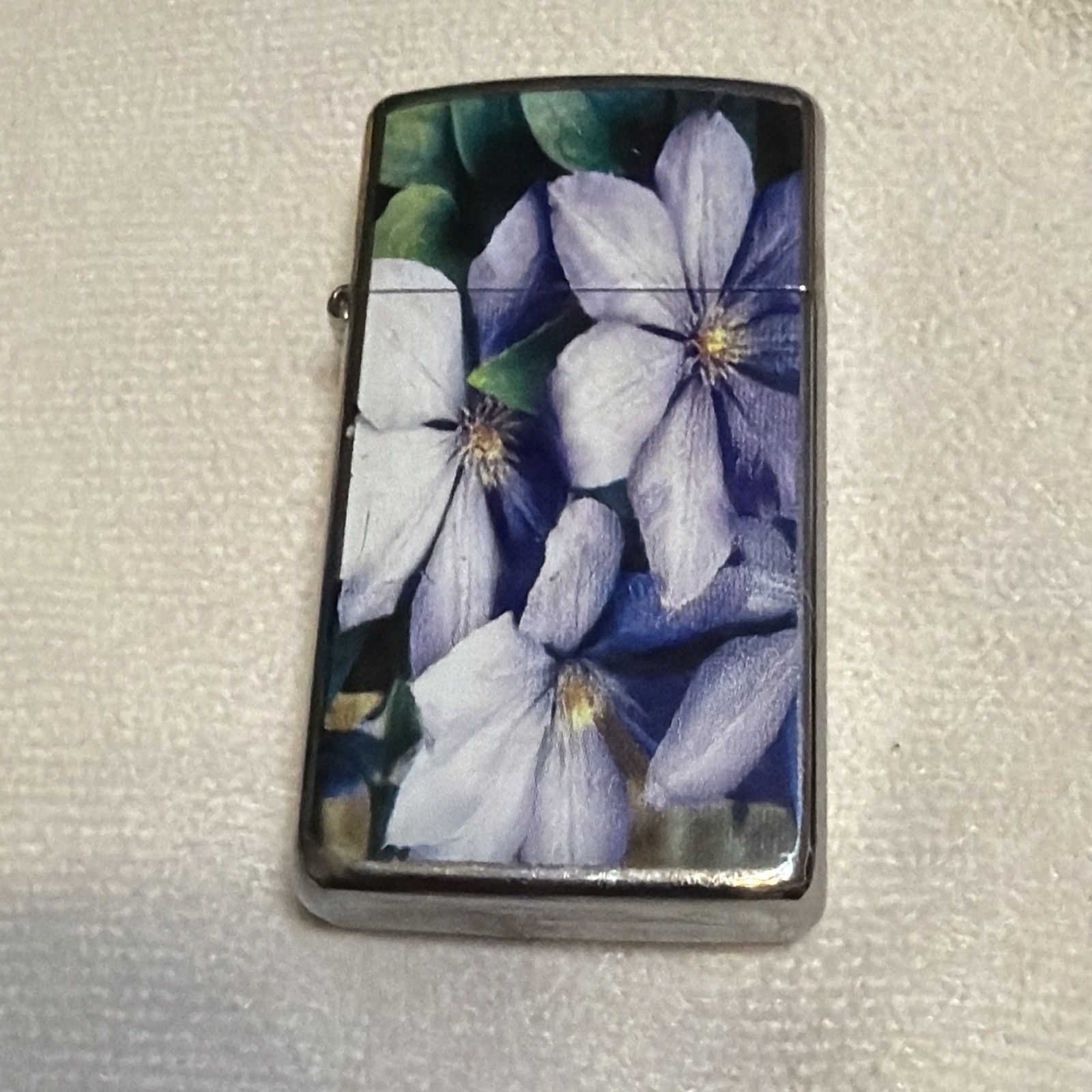 Vintage Zippo 2009 Slim Line High Polish Chrome Lighter with Purple Flowers MIB Vintage Zippo 2009 Slim Line High Polish Chrome Lighter with Purple Flowers MIB