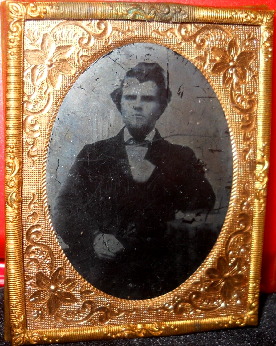 1/9th Size Ruby Ambrotype of young man in brass mat/frame