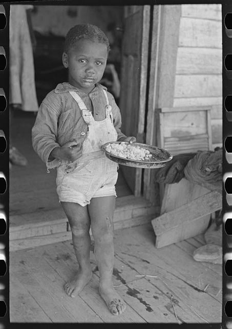 Photo:Southeast Missouri 1938 Child of Sharecropper Eating on Porch Photo:Southeast Missouri 1938 Child of Sharecropper Eating on Porch