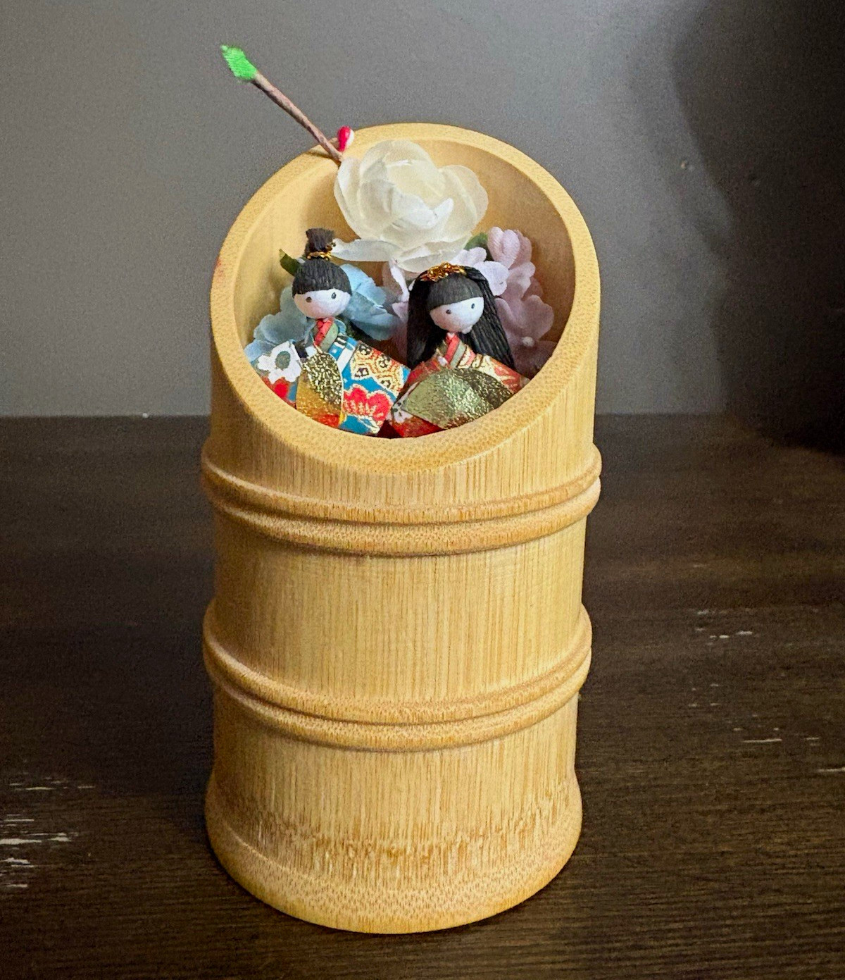 japanese miniature hina dolls in bamboo cup w/ floral decoration japanese miniature hina dolls in bamboo cup w/ floral decoration