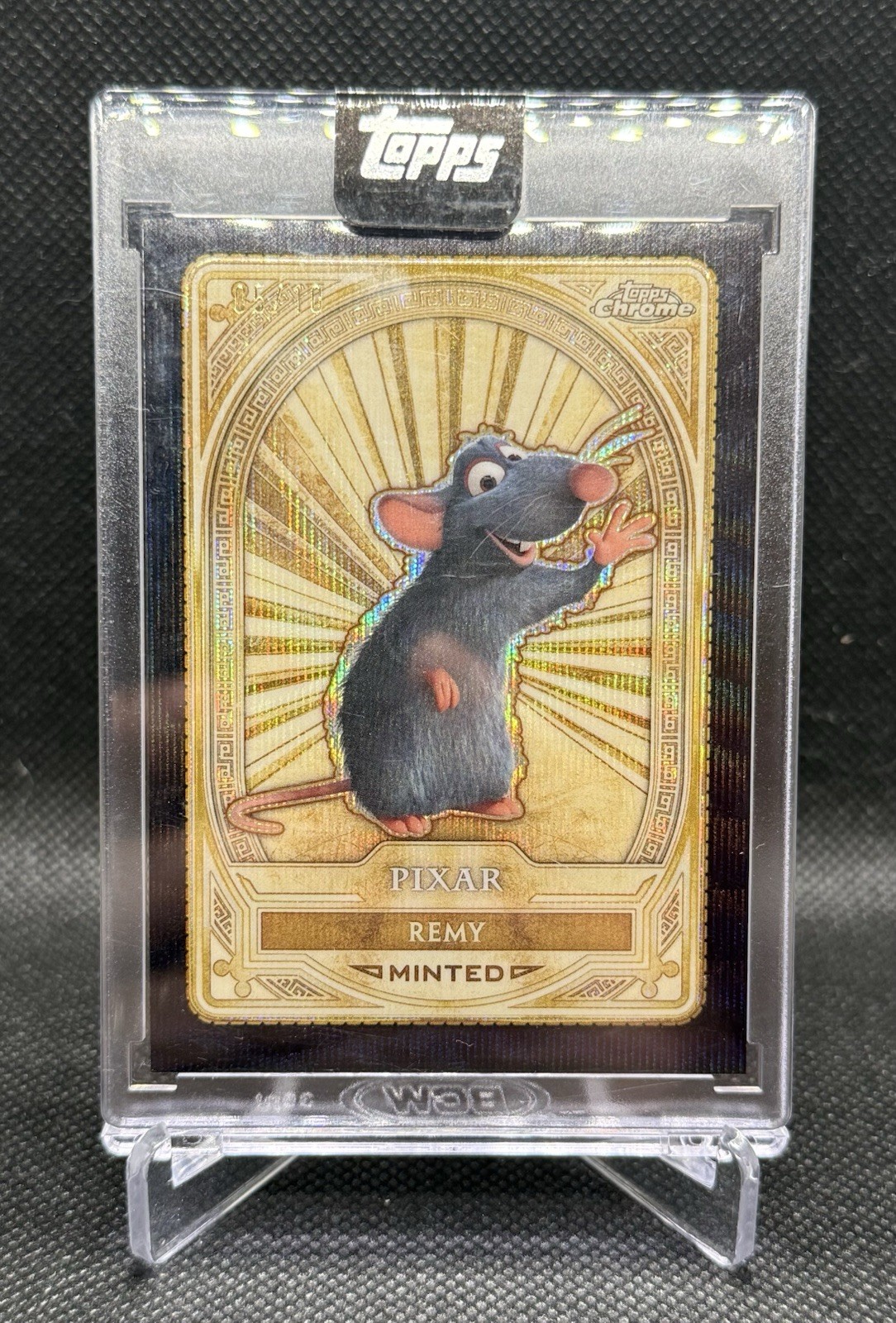 2025 Topps Disney Mint Encased Card #99 Remy Gold Black Wave /10 SSP Ratatouille 2025 Topps Disney Mint Encased Card #99 Remy Gold Black Wave /10 SSP Ratatouille