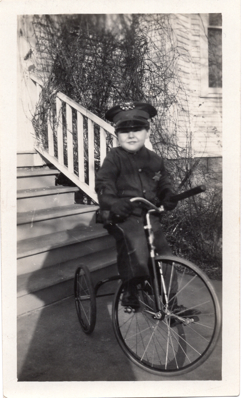 Vintage 1940s Photograph Boy in Police Uniform with Baton Riding a Tricycle Vintage 1940s Photograph Boy in Police Uniform with Baton Riding a Tricycle