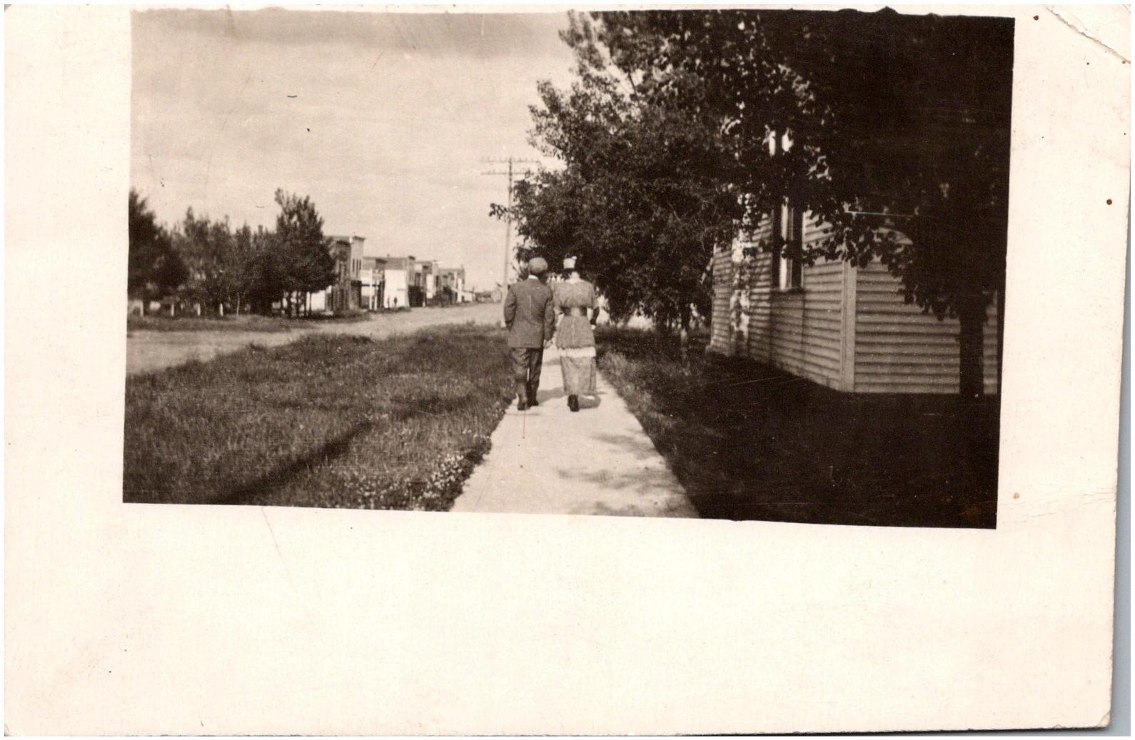 Couple Walking on Sidewalk Unidentified Location Street View 1910s RPPC Postcard Couple Walking on Sidewalk Unidentified Location Street View 1910s RPPC Postcard