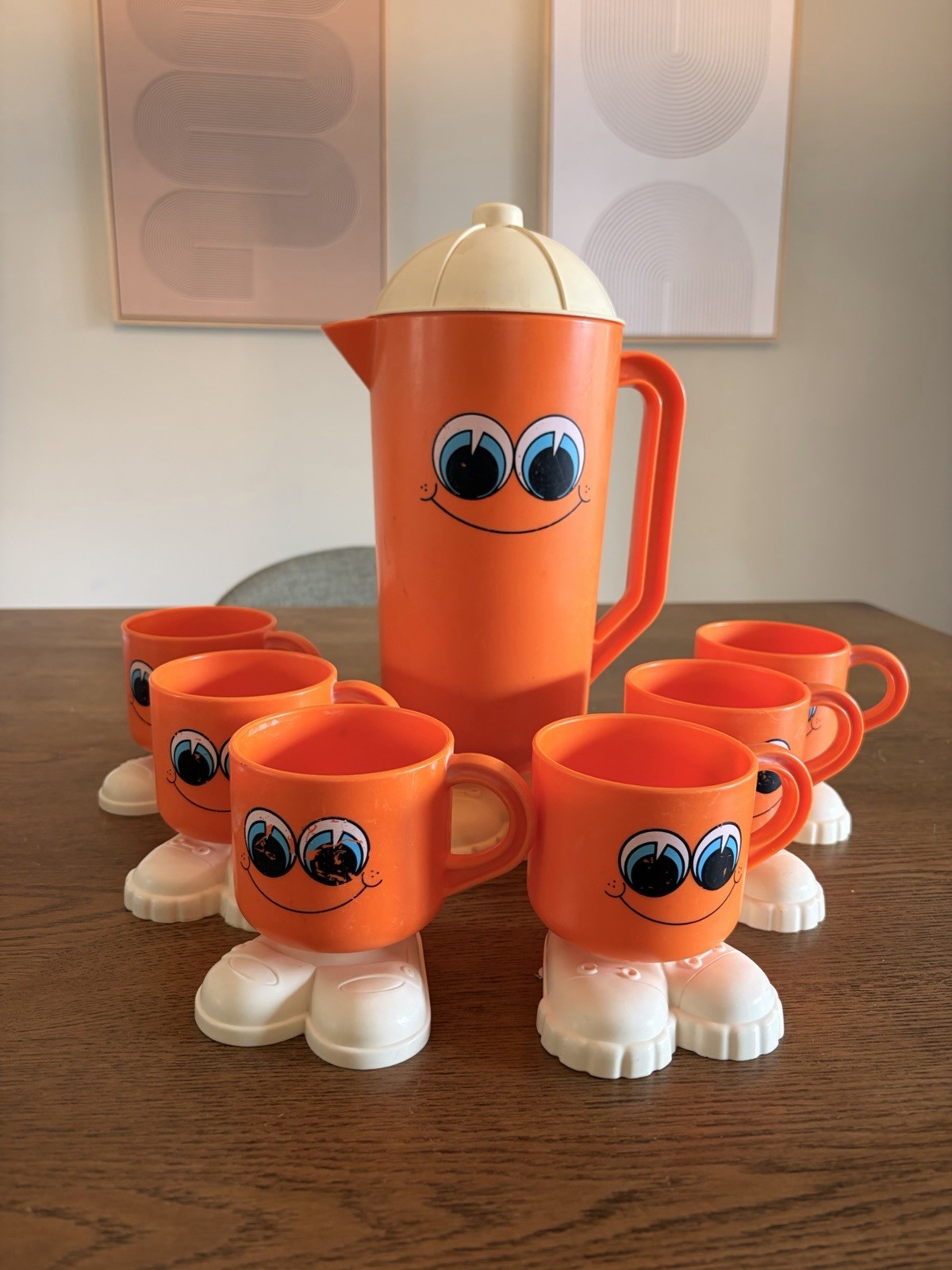 Vintage 1970s DEKA Footsie Tootsie Orange Pitcher & 6 Cups Smiley Face Set Vintage 1970s DEKA Footsie Tootsie Orange Pitcher & 6 Cups Smiley Face Set