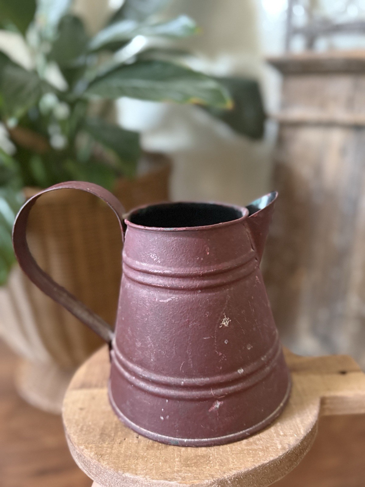 Distressed Burgundy Metal Pitcher Featuring Horizontal Ridged Accent Bands 6” Distressed Burgundy Metal Pitcher Featuring Horizontal Ridged Accent Bands 6”