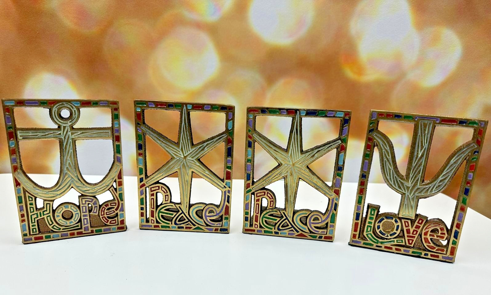 Terra Sancta Guild 1967 Brass Bookends – Hope Love Peace (4-Piece Set) Terra Sancta Guild 1967 Brass Bookends – Hope Love Peace (4-Piece Set)