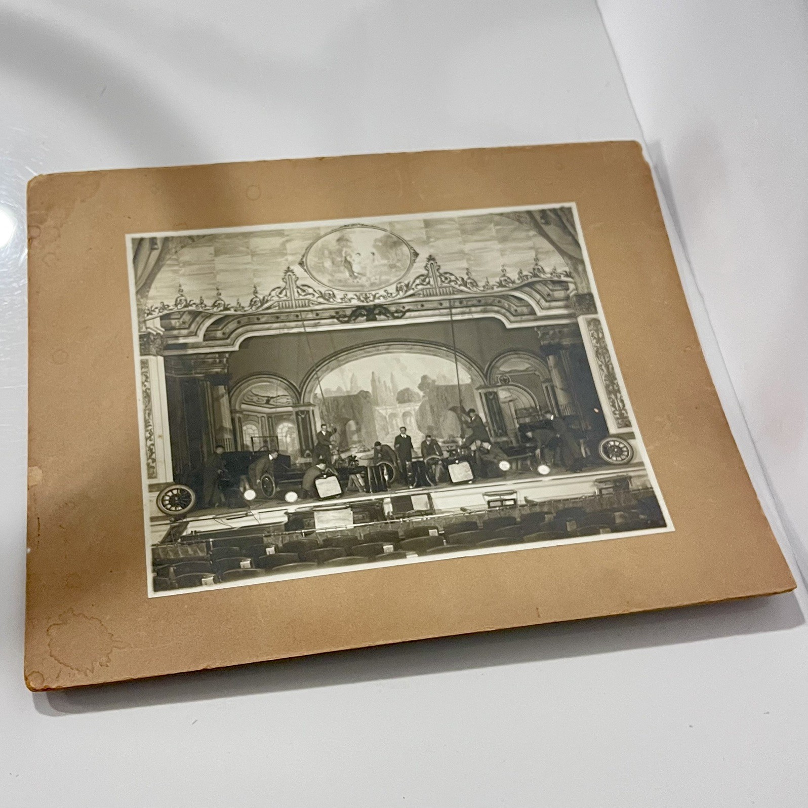 Vintage Black & White Photograph – Ornate Theater Stage with Early Automobiles Vintage Black & White Photograph – Ornate Theater Stage with Early Automobiles