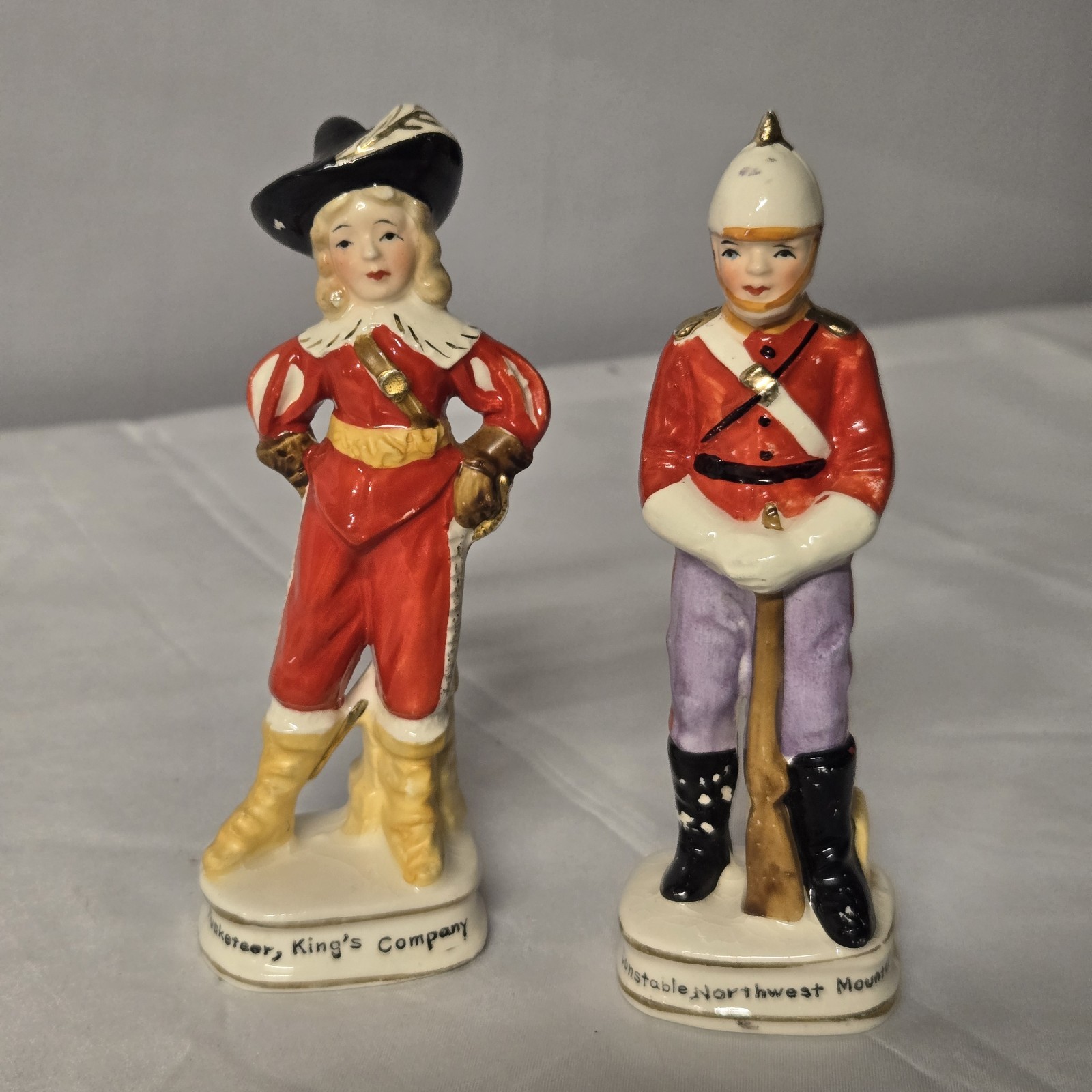 2 Vintage Enesco Japan Porc. Figures Musketeer King's Comp. & NWMP Canada E21 2 Vintage Enesco Japan Porc. Figures Musketeer King's Comp. & NWMP Canada E21