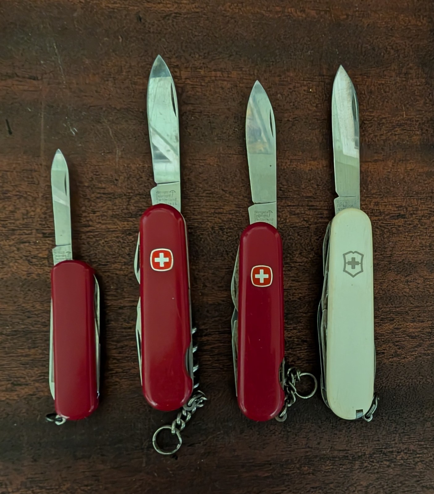 3 Vintage Wenger Delemont Swiss Army Knife and one victorinox white used
