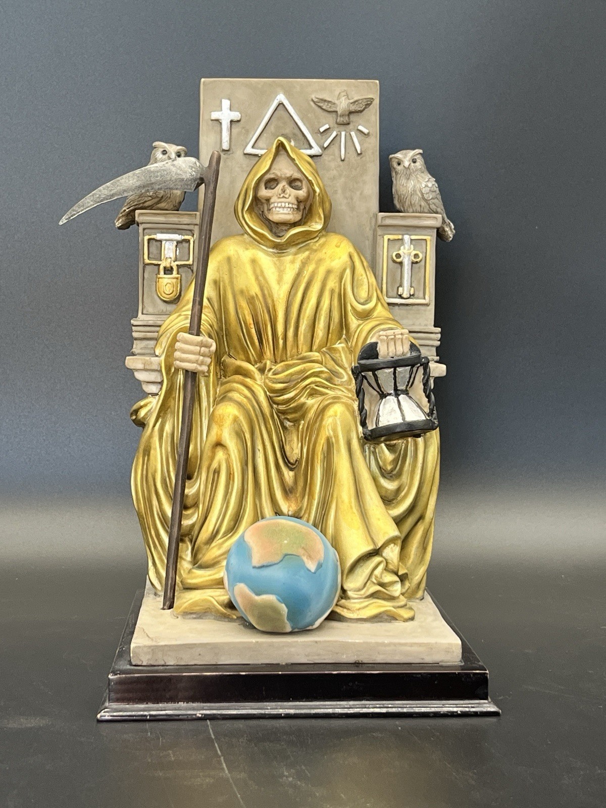 Ebros Golden Robe Santa Muerte Holy Seated On Throne with Scythe Statue 10.5"H Ebros Golden Robe Santa Muerte Holy Seated On Throne with Scythe Statue 10.5"H