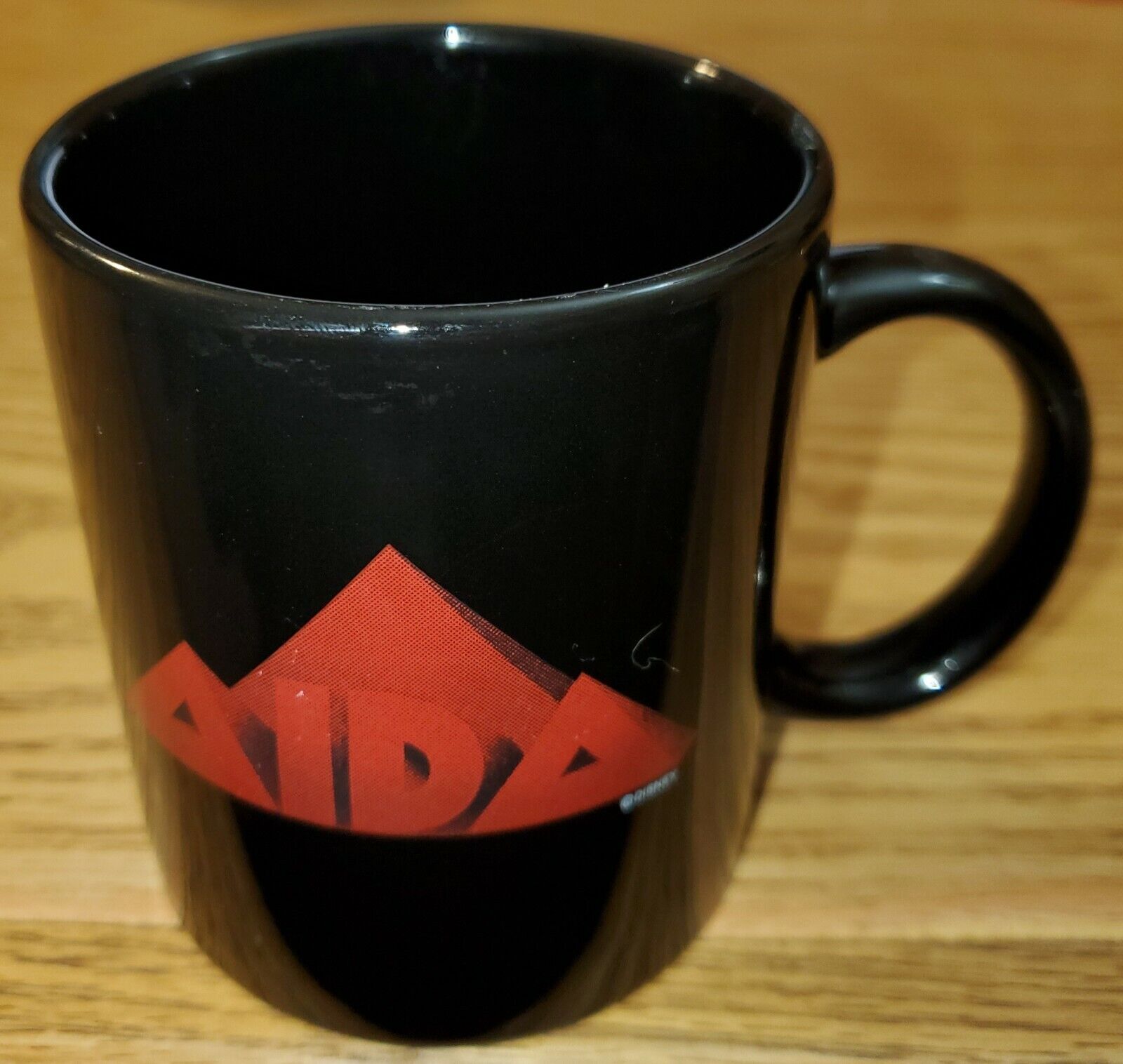AIDA Disney black coffee mug/cup Elton John & Tim Rice