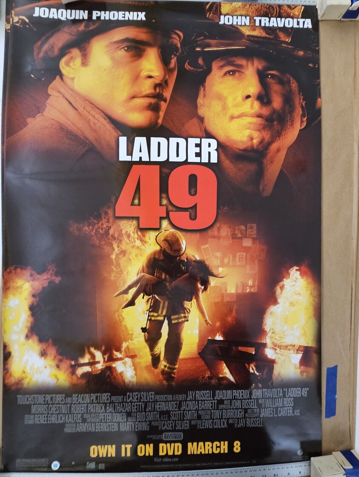 Joaquin Phoenix and John  Travolta in Ladder 49  27 DVD promotional Movie poster