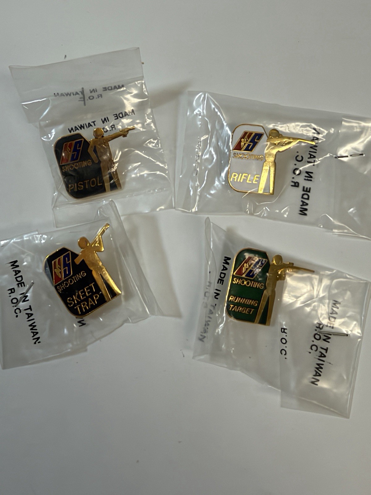 Vintage US Shooting Team Pin set of 4 NOS Vintage US Shooting Team Pin set of 4 NOS