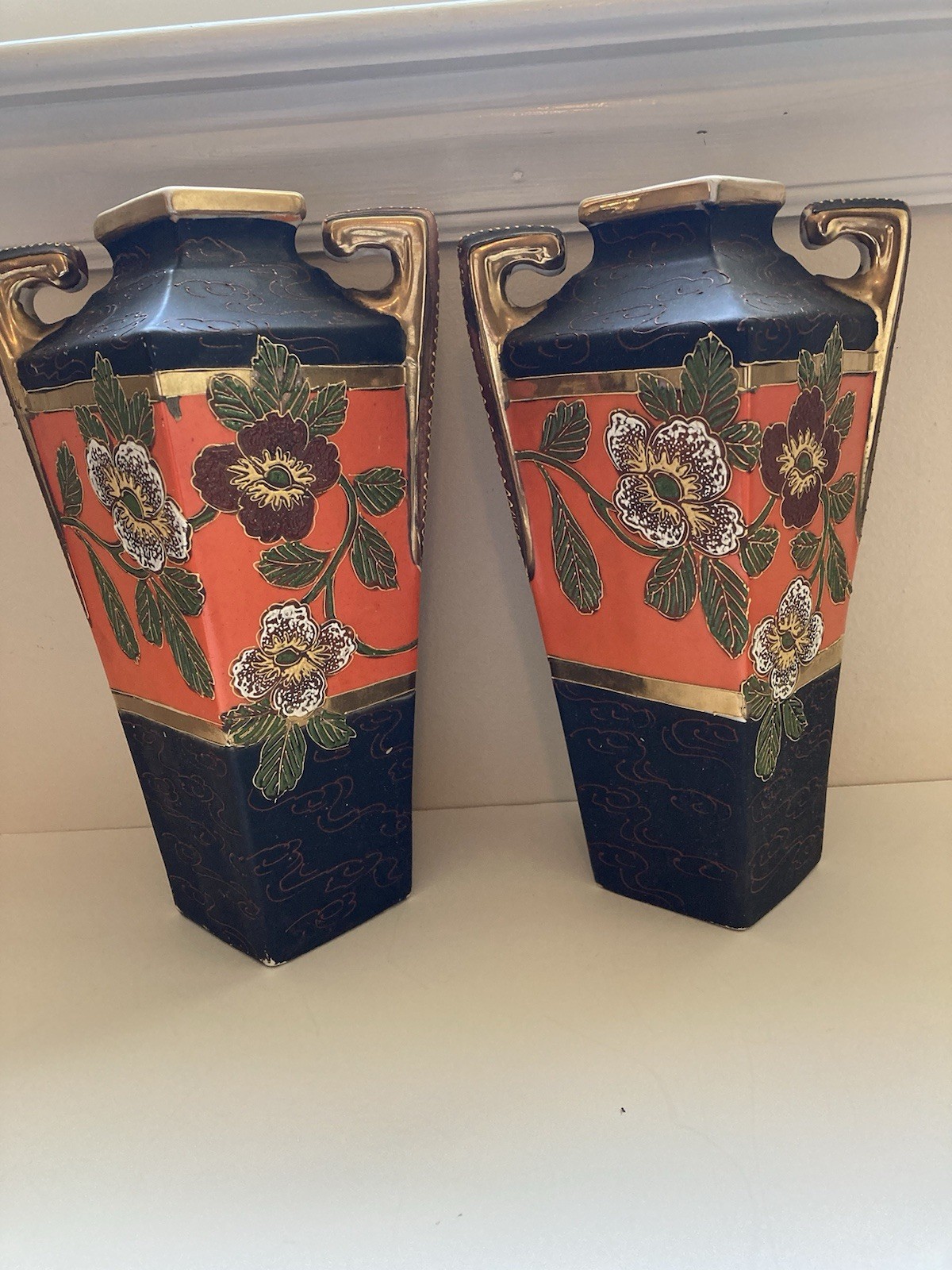 A pair of hand painted Art Nouveau vases Japan. Approximately 10 inches tall. A pair of hand painted Art Nouveau vases Japan. Approximately 10 inches tall.