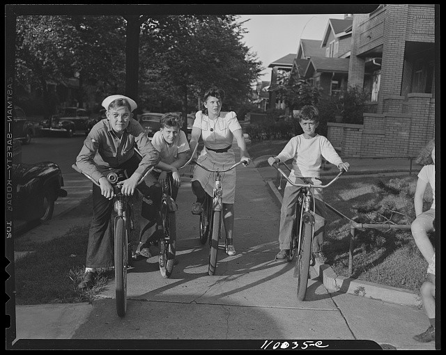 Photo:Detroit, Michigan. Boys and a girl on bicycles