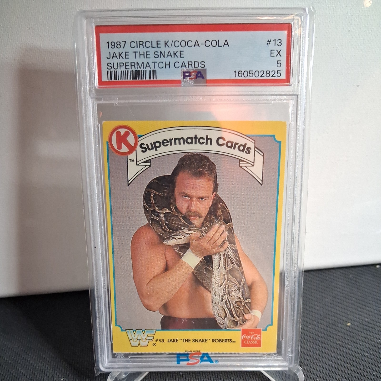1987 Circle K/Coca-Cola Supermatch #13 Jake "The Snake" Roberts PSA 5 POP 1 WWF 1987 Circle K/Coca-Cola Supermatch #13 Jake "The Snake" Roberts PSA 5 POP 1 WWF