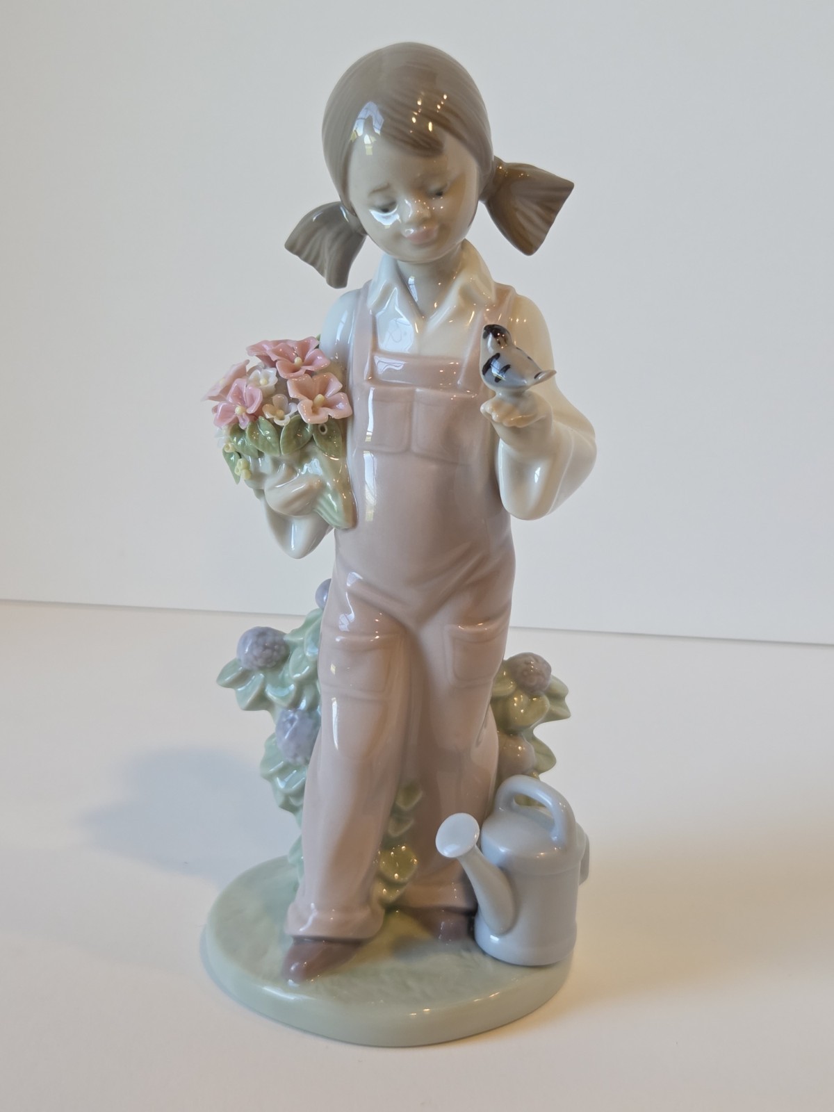 Retired Lladro Porcelain "Spring Girl" Figurine #5217 Girl With Flowers & Bird Retired Lladro Porcelain "Spring Girl" Figurine #5217 Girl With Flowers & Bird