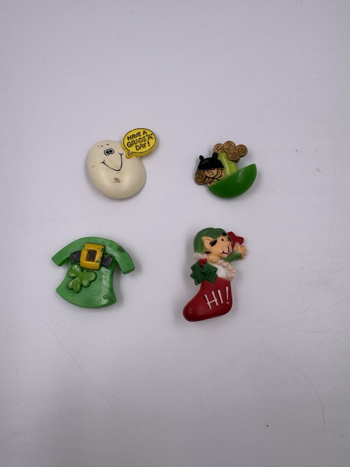 Lot of 4 Vintage Plastic Pins Egg- Have a Grade A Day, Pot Of Gold, Elf Stocking