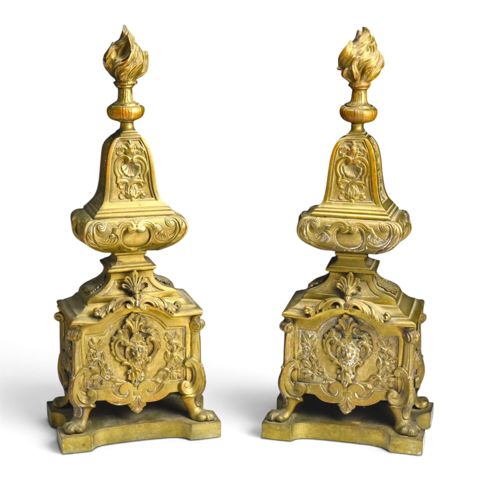 A pair of Régence style gilt-bronze chenets A pair of Régence style gilt-bronze chenets